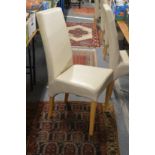 A set of six modern cream leather cloth upholstered highback dining chairs.