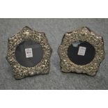 A pair of Victorian embossed silver photograph frames.