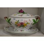 A floral decorated porcelain tureen, cover and stand complete with ladle.