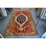 A colourful Persian design carpet 240cm x 150cm.