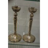 An unusual pair of Continental silver figural candlesticks.