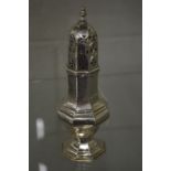 A silver octagonal shaped pedestal sugar castor.