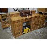 A pine pedestal dressing table.