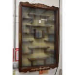 A Chinese rosewood hanging display cabinet.