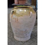 A large Continental part glazed terracotta urn.