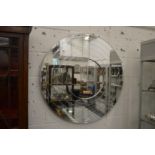 A large circular stylish wall mirror.