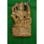 An early Indian carved soapstone figure of a deity.