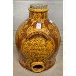A Mary Wondrausch, Wharf Pottery, Godalming, a good large wine flagon with incised script and