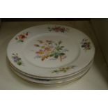 A set of four Continental floral decorated porcelain plates signed Farge.