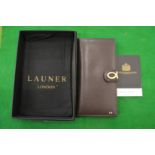 A Launer, London ladies brown leather purse with original box.