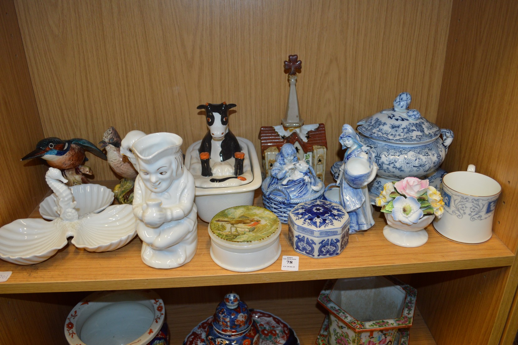 A shelf of decorative china.