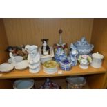 A shelf of decorative china.