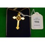 A 9ct gold cross on chain inset with various gem stones.