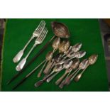 A quantity of assorted silver flatware and a toddy ladle.