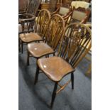 Three beech, ash and elm wheelback single dining chairs.