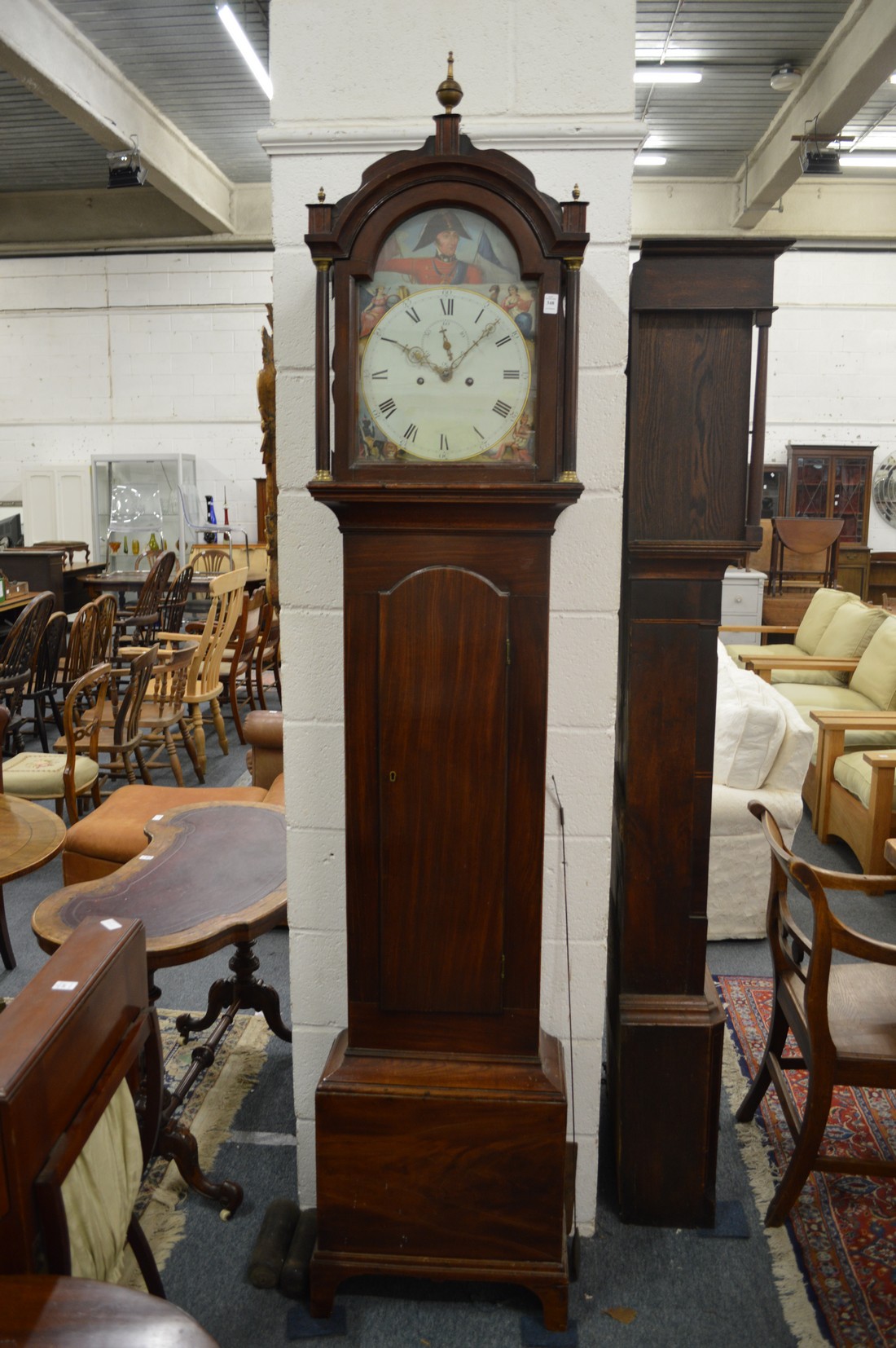A good 19th century mahogany longcase clock with eight day movement, the arched dial painted with