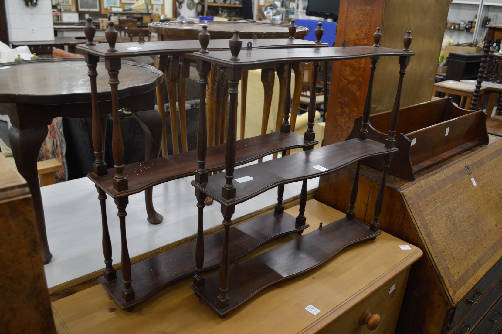 A pair of mahogany wall shelves.