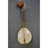 A small stringed musical instrument, possibly Ivory Coast.