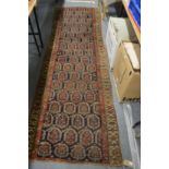 A Persian runner or hall carpet, dark blue ground with stylised Boteh decoration, ends reduced 300cm