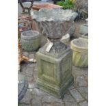 Composite garden planter with pedestal base.