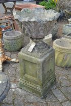 Composite garden planter with pedestal base.