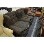 A pair of large Victorian button upholstered armchairs.