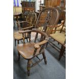 A Victorian ash and elm broad arm Windsor chair.
