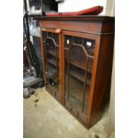 A mahogany bookcase top.