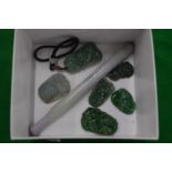 A collection of jade amulets and other items.
