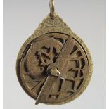 A FINE 19TH CENTURY PERSIAN QAJAR ENGRAVED BRASS ASTROLABE, 6.5cm wide.