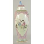 A CHINESE FAMILLE ROSE PORCELAIN VASE AND COVER, with two panels of female figures, character mark