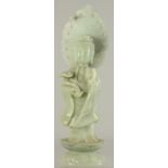 A LARGE CHINESE CARVED JADE BUDDHISTIC FIGURE, holding a ruyi scepter and with halo, 33.5cm high.
