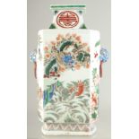 A CHINESE FAMILLE VERTE PORCELAIN TWIN HANDLE VASE, painted with dragon, fish, deer, cranes, and