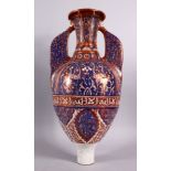 A 19TH CENTURY ISLAMIC SPANISH HISPANO-MORESQUE POTTERY TWIN HANDLE GAZELLE VASE, with a lustre