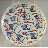 A TURKISH OTTOMAN GLAZED POTTERY PLATE, 30.5cm diameter.