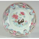 A CHINESE FAMILLE ROSE PORCELAIN CHARGER, enamel painted with birds and native flora, 35cm