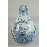 A LARGE 18TH CENTURY CHINESE BLUE AND WHITE PORCELAIN JUG, painted with native flora and with