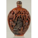 A CHINESE RHINO HORN-TYPE SNUFF BOTTLE, with Shao Lao and attendants, 10cm high.