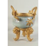 A CHINESE POWDER BLUE CRACKLE GLAZE BRASS MOUNTED CENSER, with dragon form handles mounted to the