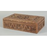 A FINE CHINESE CARVED WOOD DRAGON CIGAR BOX, the hinged lid with two relief dragons and a bird, 32cm