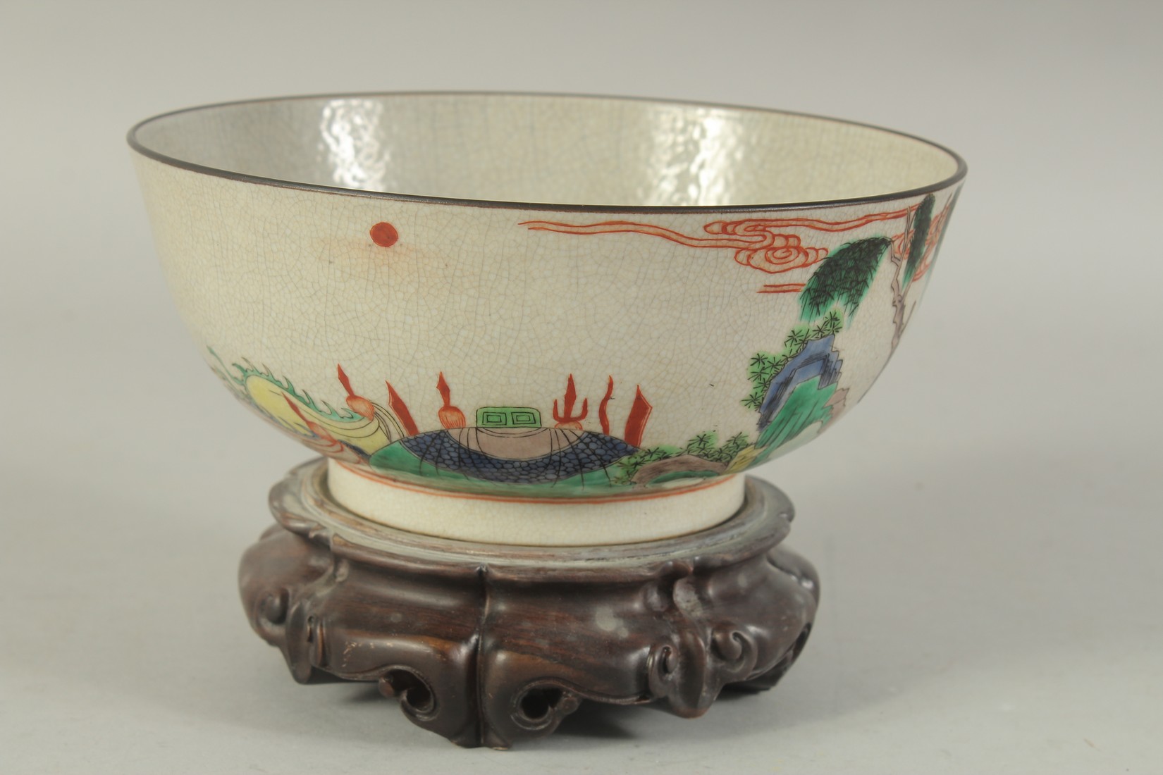 A CHINESE FAMILLE VERTE PORCELAIN BOWL - possibly Qing dynasty, with hardwood stand, the exterior - Image 2 of 7