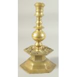 AN UNUSUAL 18TH-19TH CENTURY POSSIBLY OTTOMAN ARMINIAN BRASS CANDLESTICK, depicting angels around