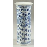 A CHINESE BLUE AND WHITE PORCELAIN SLEEVE VASE, painted with dragons and floral motif, (af), 20cm