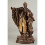 A 19TH CENTURY TERRACOTTA STATUE OF AN ARAB MAN AND LADY, signed H. Moreau, 68cm high.