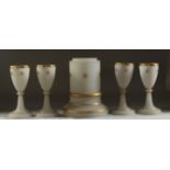 A SET OF ISLAMIC MARKET OPALINE GLASS, comprising four glasses and one stand, (5 pieces).