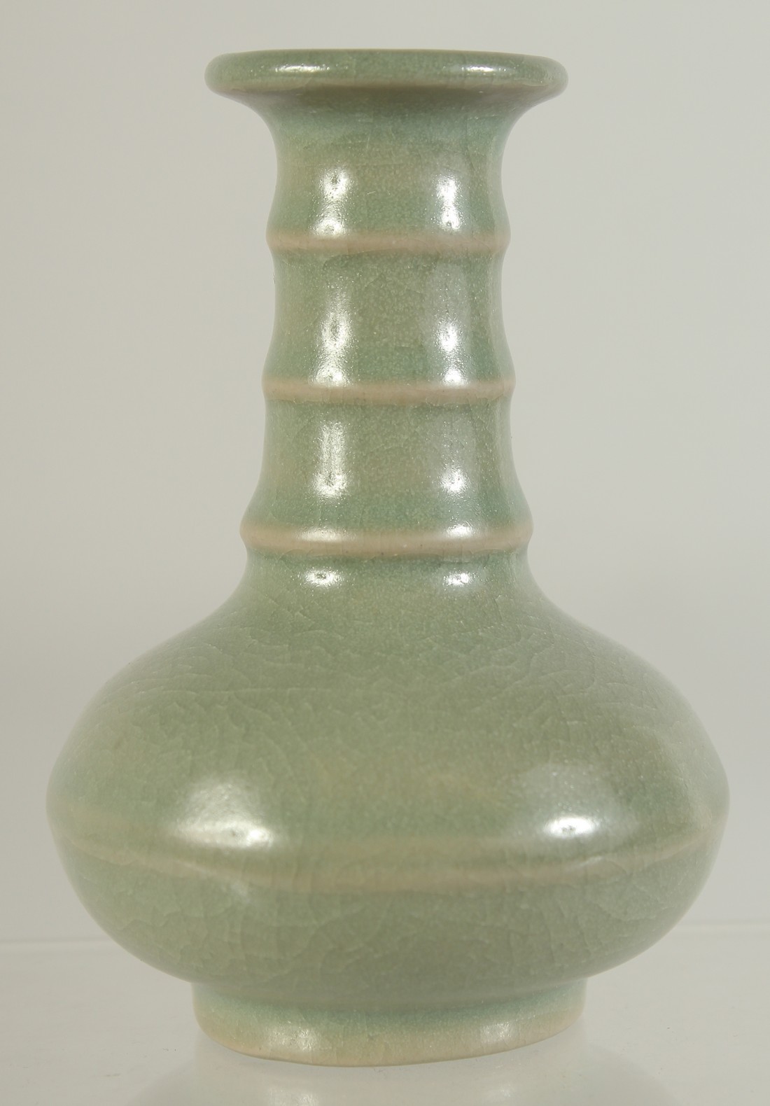 A SMALL CHINESE CELADON GLAZE VASE, 10cm high.