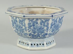 A 20TH CENTURY CHINESE OCTAGONAL BLUE AND WHITE PORCELAIN JARDINIERE, 21.5cm at widest point.