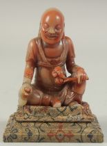 A CHINESE REPUBLIC PERIOD SOAPSTONE LUOHAN FIGURE AND STAND. figure 8cm high.
