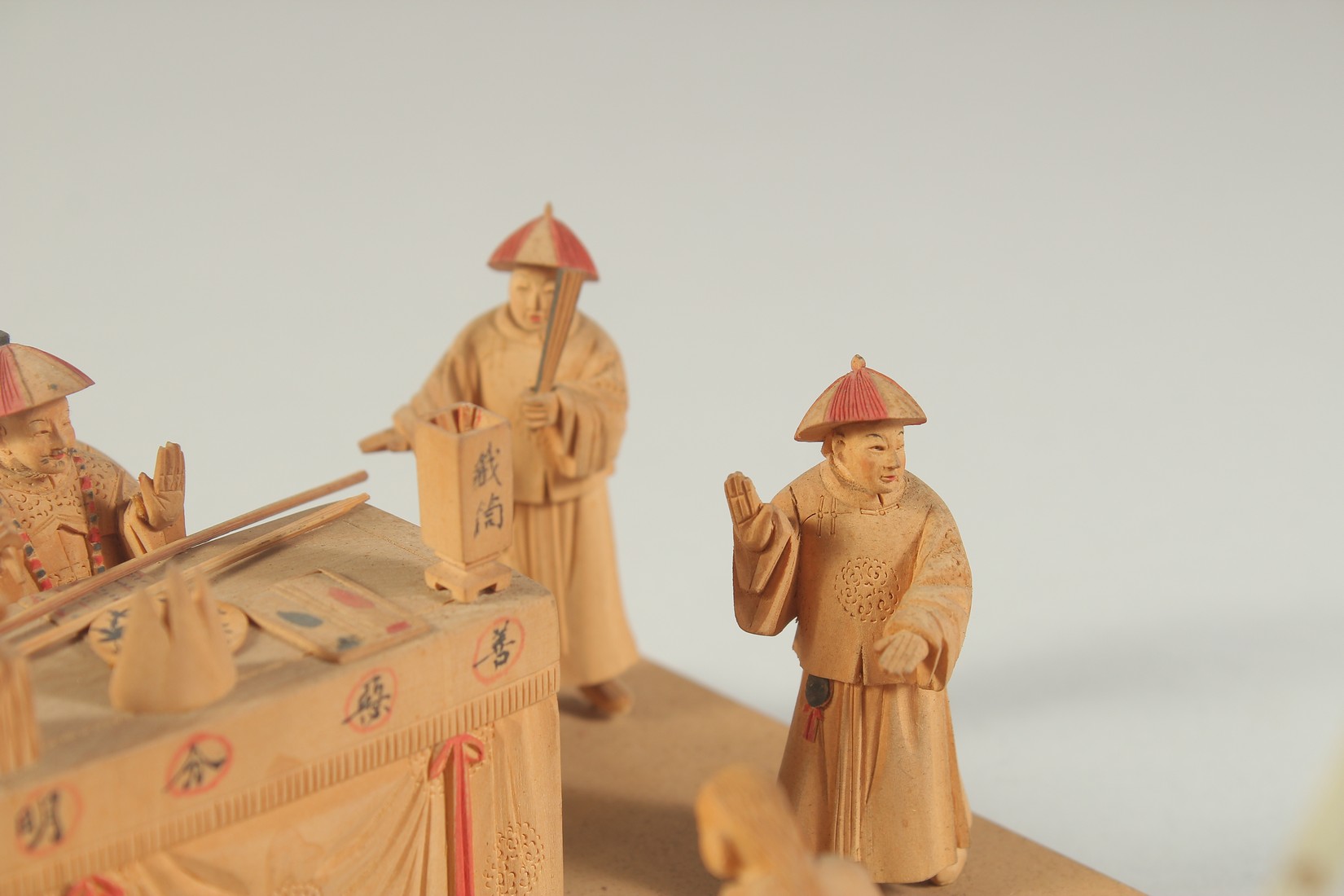 A LATE 19TH CENTURY CHINESE CARVED WOOD FIGURAL DIORAMA, mounted to later base, each figure with - Image 3 of 6