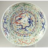 A LARGE CHINESE DOUCAI PORCELAIN CHARGER, (af), 44cm diameter.